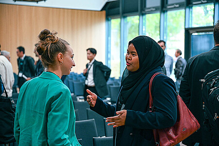 two guests talking at FKFS Conference